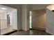 Bright and airy living room featuring new gray laminate flooring, neutral walls, and natural light streaming in through the door at 5523 Westview Dr, Orlando, FL 32810
