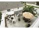 Inviting backyard featuring an outdoor kitchen, seating area, and lush landscaping, perfect for entertaining at 1485 Waukon Cir, Casselberry, FL 32707