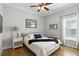 Cozy bedroom with natural light, ceiling fan, and calming decor, a peaceful retreat for rest and relaxation at 1485 Waukon Cir, Casselberry, FL 32707