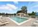 Enjoy the community pool with lounge chairs, a covered area and manicured landscaping at 1485 Waukon Cir, Casselberry, FL 32707
