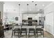 Modern kitchen with a breakfast bar, stainless steel appliances, white cabinetry, and sleek countertops at 1485 Waukon Cir, Casselberry, FL 32707
