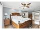 Spacious main bedroom featuring a hardwood floor, a king bed, bedside tables and an ensuite bathroom at 1485 Waukon Cir, Casselberry, FL 32707