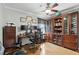 Well-appointed home office with built-in shelving, a spacious desk, and ample storage for productivity at 1485 Waukon Cir, Casselberry, FL 32707