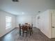 Dining room with modern wood floors and natural light offers versatile space at 938 Mansfield Rd, Tavares, FL 32778