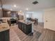 Modern kitchen with stainless steel appliances, dark wood cabinets, and an island with a workstation at 938 Mansfield Rd, Tavares, FL 32778