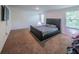 Main bedroom with carpet, natural light, and ample space for relaxation and comfort at 938 Mansfield Rd, Tavares, FL 32778