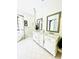 Well-lit bathroom with marble countertops, and and sinks at 1234 W Ivanhoe Blvd, Orlando, FL 32804