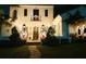A stunning home exterior illuminated with holiday lights, wreaths, and manicured landscaping creates inviting curb appeal at 1234 W Ivanhoe Blvd, Orlando, FL 32804