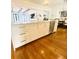 Gourmet kitchen island featuring a white countertop, ample storage, and modern stainless steel appliances at 1234 W Ivanhoe Blvd, Orlando, FL 32804