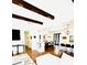 Open-concept living area with hardwood floors, modern decor, and a view of the dining and kitchen areas at 1234 W Ivanhoe Blvd, Orlando, FL 32804