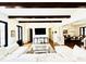 Open-concept living area with hardwood floors, beamed ceilings, and a seamless flow to the dining area at 1234 W Ivanhoe Blvd, Orlando, FL 32804