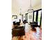 Elegant living room with dark accents, terracotta tile and four leather armchairs at 1234 W Ivanhoe Blvd, Orlando, FL 32804