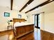 Inviting main bedroom featuring wood floors, beamed ceilings, and French doors for natural light at 1234 W Ivanhoe Blvd, Orlando, FL 32804