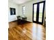 Bright room with hardwood floors, adjacent to black framed glass doors at 1234 W Ivanhoe Blvd, Orlando, FL 32804