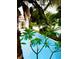The sparkling pool, viewed through palm trees and plumeria, offers a refreshing oasis in a tropical setting at 1234 W Ivanhoe Blvd, Orlando, FL 32804