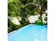 The tranquil pool features clear blue water and gentle fountains surrounded by lush tropical greenery at 1234 W Ivanhoe Blvd, Orlando, FL 32804