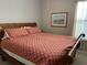Bedroom with a wooden sleigh bed and carpet at 1446 Vivaldi Pl, Longwood, FL 32779