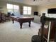 Spacious game room featuring a pool table and a comfortable seating area at 1446 Vivaldi Pl, Longwood, FL 32779