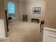Formal living room with plush carpeting, wainscoting and a fireplace at 1446 Vivaldi Pl, Longwood, FL 32779