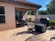Covered patio with outdoor seating and grilling area at 1446 Vivaldi Pl, Longwood, FL 32779