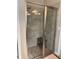 Modern bathroom shower features a glass enclosure with a seat at 1446 Vivaldi Pl, Longwood, FL 32779