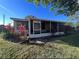 Charming single-story home with a screened-in porch and well-maintained landscaping at 4395 E Michigan St # 4395, Orlando, FL 32812