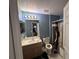 A cozy bathroom with a vanity and shower at 2921 Blackburn Ave, Deltona, FL 32738
