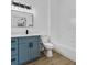 Bathroom with blue vanity, black hardware, large mirror, and shower-tub combo at 584 Brantley Terrace Way # 200, Altamonte Springs, FL 32714
