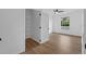 Bright bedroom featuring hardwood floors, a ceiling fan, and closet with shelving at 584 Brantley Terrace Way # 200, Altamonte Springs, FL 32714