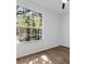 Cozy bedroom with a large window letting in lots of natural light, and a ceiling fan at 584 Brantley Terrace Way # 200, Altamonte Springs, FL 32714