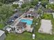 Aerial view of the community pool with lounge chairs and nearby parking at 584 Brantley Terrace Way # 200, Altamonte Springs, FL 32714
