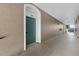 Hallway view of the unit's entrance door and a view of the staircase at the end at 584 Brantley Terrace Way # 200, Altamonte Springs, FL 32714