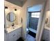 Stylish bathroom with a white vanity, modern fixtures, and a beautifully tiled shower at 1980 Water Ln, Maitland, FL 32751