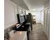 An efficient kitchen layout that features stainless steel appliances and modern countertops at 1980 Water Ln, Maitland, FL 32751