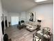 Open concept living and dining room featuring a fireplace, and vaulted ceilings at 1980 Water Ln, Maitland, FL 32751