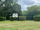 A shot of Branch Tree Park including the park sign and swing set at 1980 Water Ln, Maitland, FL 32751