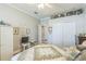 Bedroom featuring ample closet space, ceiling fan, and neutral decor at 2000 Farmington Ct, Clermont, FL 34711