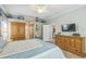 Well-appointed bedroom, featuring a ceiling fan, and views into the en suite bath at 2000 Farmington Ct, Clermont, FL 34711