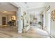 Inviting foyer with grand piano to left, dining area in front, and entrance to right at 2000 Farmington Ct, Clermont, FL 34711