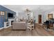 Comfortable living room with hardwood floors, fireplace, and lots of light creating an inviting space for relaxation at 2000 Farmington Ct, Clermont, FL 34711