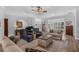 Well-appointed living room with comfortable seating, hardwood floors, and an open layout, ideal for entertaining guests at 2000 Farmington Ct, Clermont, FL 34711