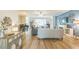 Expansive living area with wood floors, sophisticated furnishings, and a neutral color palette, creating an inviting atmosphere at 2000 Farmington Ct, Clermont, FL 34711