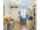 Comfortable office space with a closet, work desk, and chair with natural lighting at 2000 Farmington Ct, Clermont, FL 34711