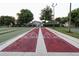 Outdoor shuffleboard court with clearly marked scoring zones, providing a fun and engaging activity at 2000 Farmington Ct, Clermont, FL 34711