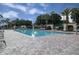 Large outdoor swimming pool surrounded by a spacious deck with lounge chairs, perfect for relaxation at 2000 Farmington Ct, Clermont, FL 34711