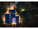 Expansive aerial view of a luxurious estate featuring a large pool, manicured grounds, and multiple structures at 13450 E Lake Mary Jane Rd, Orlando, FL 32832