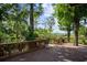 Relaxing deck offers a serene view of the lush landscape and sparkling waterfront at 13450 E Lake Mary Jane Rd, Orlando, FL 32832