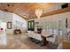 Bright dining room with a wooden table, stylish white chairs, and large windows at 13450 E Lake Mary Jane Rd, Orlando, FL 32832