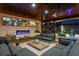 Stylish living room with comfortable seating, modern fireplace, and large windows overlooking the serene outdoors at 13450 E Lake Mary Jane Rd, Orlando, FL 32832
