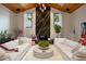 Living room with a vaulted ceiling, black marble fireplace, and stylish decor at 13450 E Lake Mary Jane Rd, Orlando, FL 32832